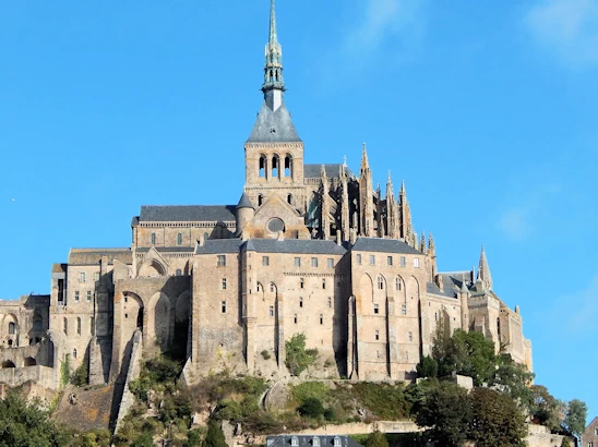 Experience the breathtaking beauty of Mont Saint-Michel on a day trip from Paris. This guide covers transportation options, must-see sights, and tips for making the most of your visit to this iconic island commune, famous for its stunning abbey and picturesque views