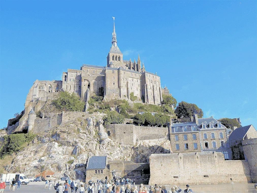 Experience the breathtaking beauty of Mont Saint-Michel on a day trip from Paris. This guide covers transportation options, must-see sights, and tips for making the most of your visit to this iconic island commune, famous for its stunning abbey and picturesque views