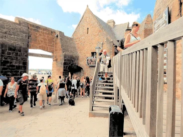 Experience the breathtaking beauty of Mont Saint-Michel on a day trip from Paris. This guide covers transportation options, must-see sights, and tips for making the most of your visit to this iconic island commune, famous for its stunning abbey and picturesque views