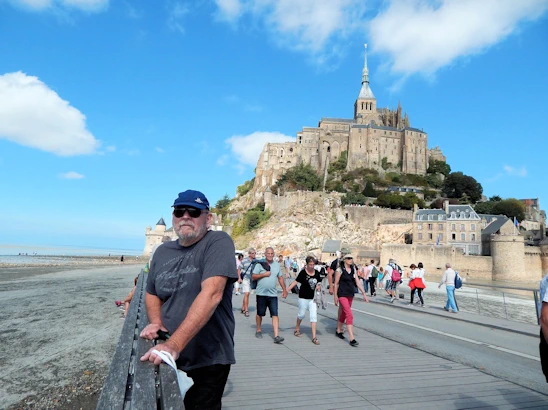 Experience the breathtaking beauty of Mont Saint-Michel on a day trip from Paris. This guide covers transportation options, must-see sights, and tips for making the most of your visit to this iconic island commune, famous for its stunning abbey and picturesque views