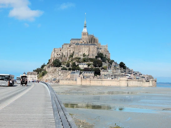 Experience the breathtaking beauty of Mont Saint-Michel on a day trip from Paris. This guide covers transportation options, must-see sights, and tips for making the most of your visit to this iconic island commune, famous for its stunning abbey and picturesque views