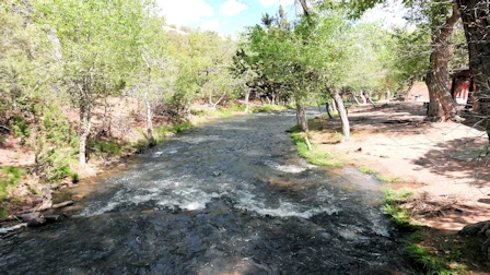 Explore Nambe Falls, a stunning 120-foot waterfall located just 16 miles from Santa Fe. Discover two scenic hiking trails—one leading to the top for panoramic views and the other to the base for a closer look. Experience the natural beauty and cultural significance of this Nambe Pueblo treasure