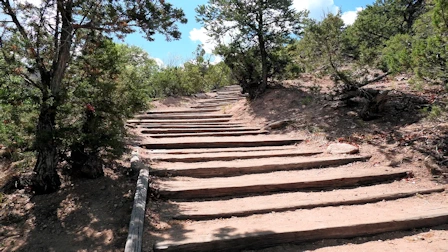 Explore Nambe Falls, a stunning 120-foot waterfall located just 16 miles from Santa Fe. Discover two scenic hiking trails—one leading to the top for panoramic views and the other to the base for a closer look. Experience the natural beauty and cultural significance of this Nambe Pueblo treasure