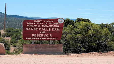 Explore Nambe Falls, a stunning 120-foot waterfall located just 16 miles from Santa Fe. Discover two scenic hiking trails—one leading to the top for panoramic views and the other to the base for a closer look. Experience the natural beauty and cultural significance of this Nambe Pueblo treasure