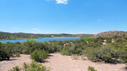 Explore Nambe Falls, a stunning 120-foot waterfall located just 16 miles from Santa Fe. Discover two scenic hiking trails—one leading to the top for panoramic views and the other to the base for a closer look. Experience the natural beauty and cultural significance of this Nambe Pueblo treasure